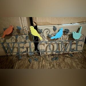 Iron rod “Welcome” art